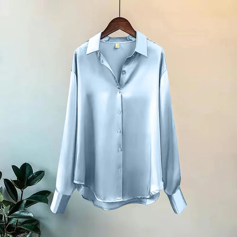 Women's chic oversized button-down shirt. Flowy long sleeves, versatile for a polished workwear or casual look.