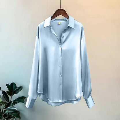 Women's chic oversized button-down shirt. Flowy long sleeves, versatile for a polished workwear or casual look.