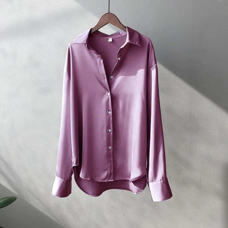 Versatile women's elegant oversized shirt. Long-sleeve button-down blouse, ideal for contemporary chic fashion.