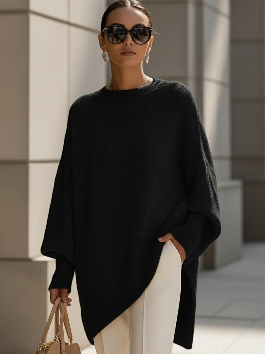 Stylish women's poncho sweater. Elegant oversized cape for autumn layering. Draped knit comfort.