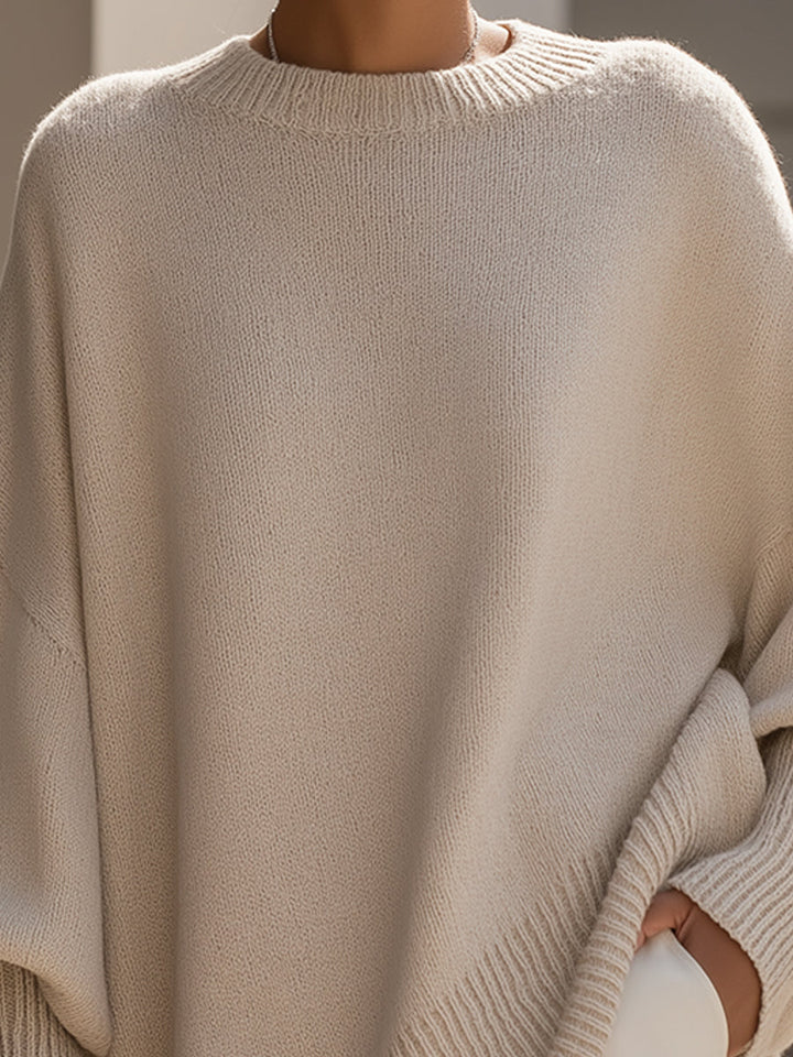 Cozy women's poncho sweater, perfect for autumn layering. Chic oversized fit with elegant drape.