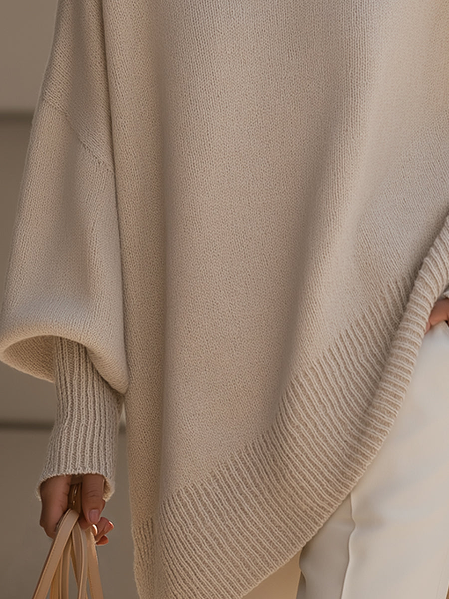 Versatile women's cape sweater. Draped oversized poncho with comfortable batwing sleeves.