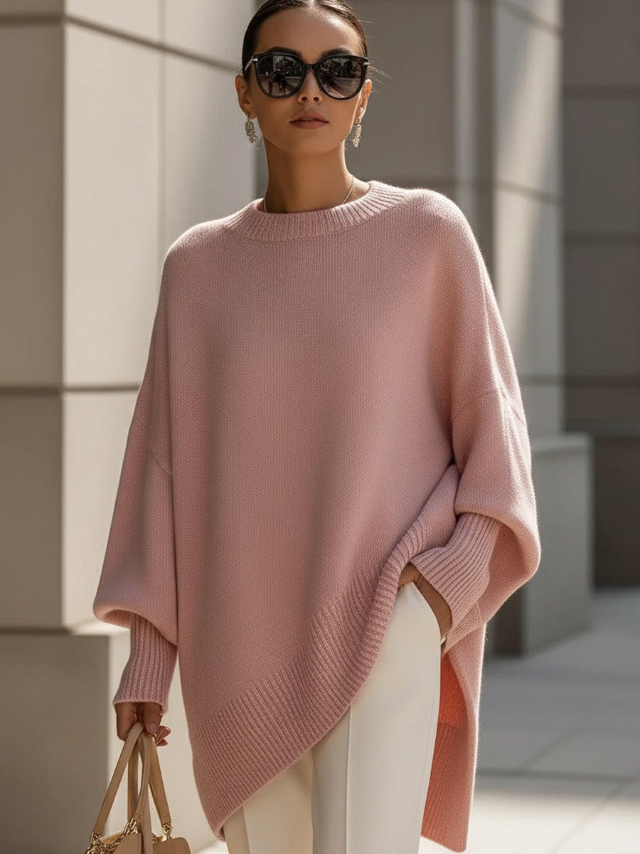 Chic women's cape poncho sweater. Versatile oversized knit, perfect for elegant autumn layering.