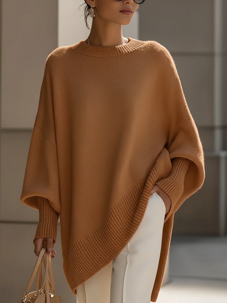 Women's elegant poncho sweater. Oversized cape knit, ideal for versatile layering & comfort.