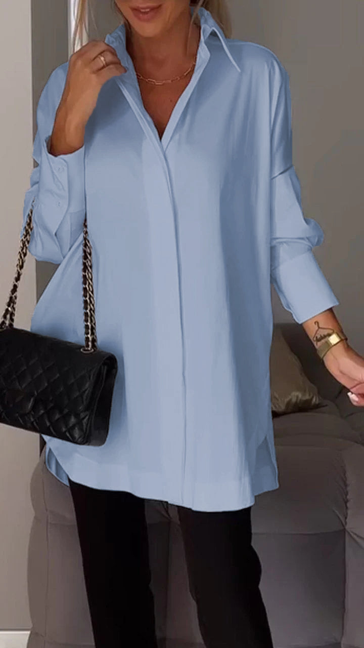 Modern women's oversized collared blouse with long sleeves, a stylish top for spring and summer fashion.