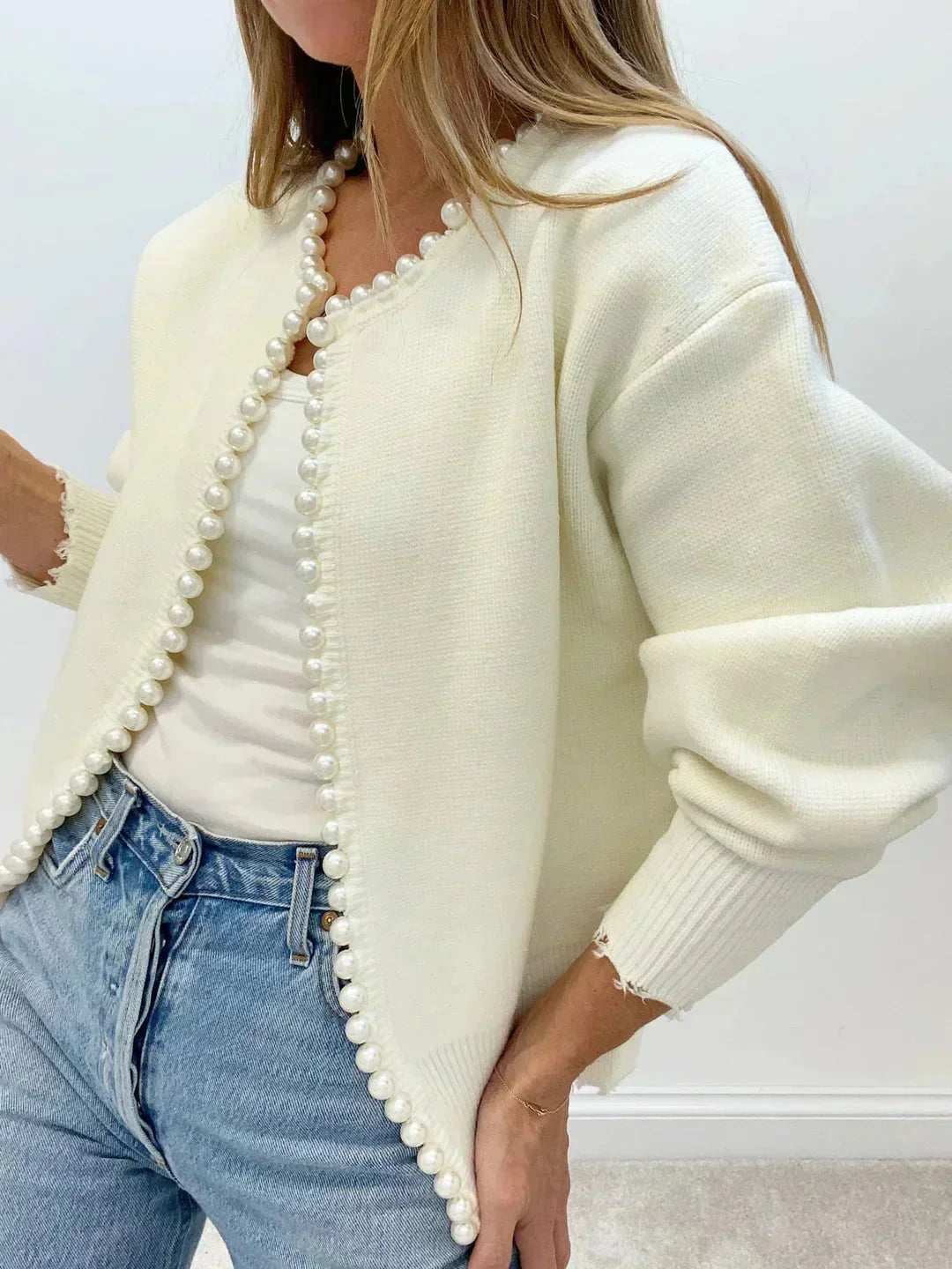 Elegant women's pearl trim cardigan. Chic long sleeve round neck for sophisticated layering & workwear.