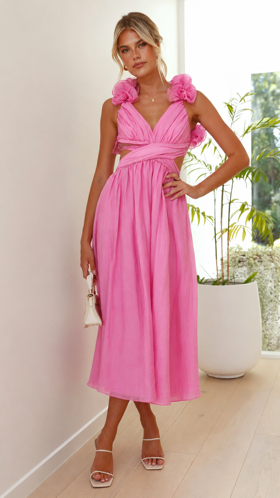 Stunning women's pink ruffle maxi dress with delicate lace-up back, ideal for summer wedding events.