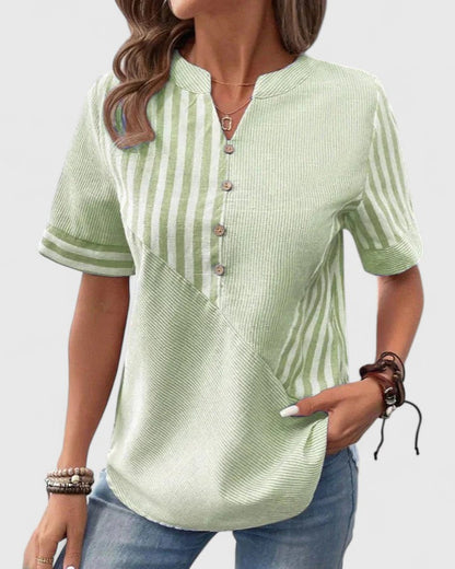 Elegant women's pink striped blouse, relaxed fit, perfect for sophisticated casual wear or work outfits.