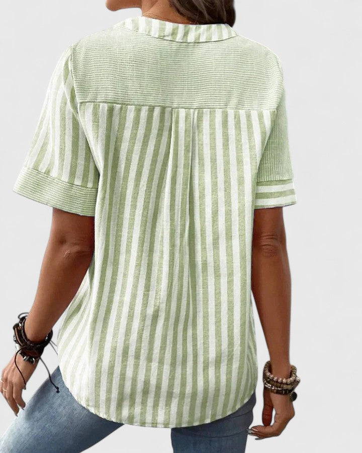 Versatile women's sophisticated striped blouse, elegant design for workwear or smart casual occasions.