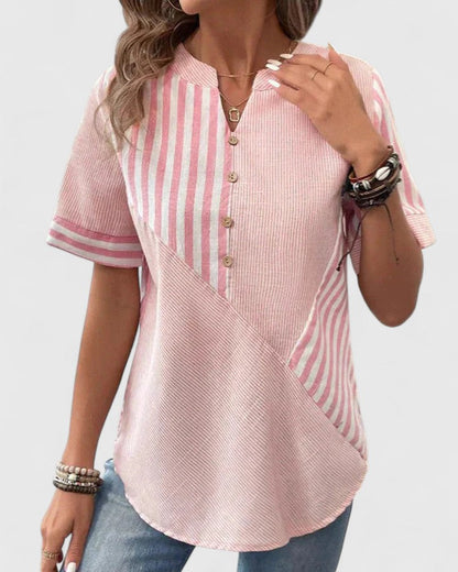 Chic women's striped workwear blouse, relaxed fit, offering a polished and professional yet comfortable style.