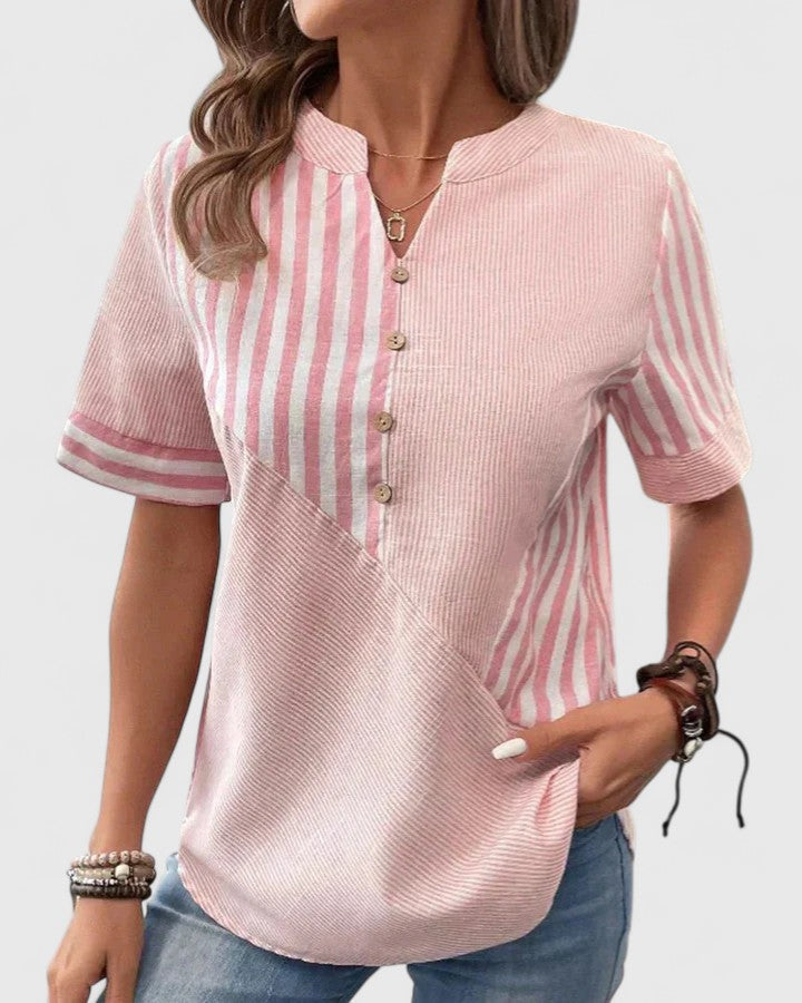 Relaxed fit women's striped blouse, elegantly casual, perfect for a sophisticated everyday fashion statement.