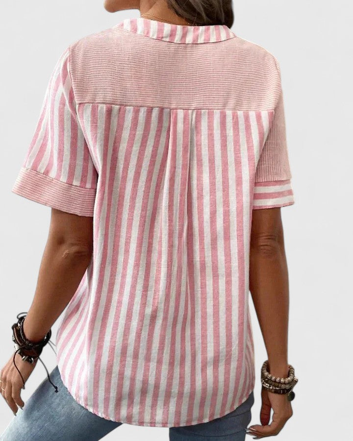 Sophisticated women's striped blouse, a versatile fashion piece with an elegant, relaxed fit for all occasions.