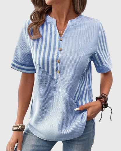 Elegant striped blouse for women, featuring a relaxed fit for ultimate comfort and sophisticated style.
