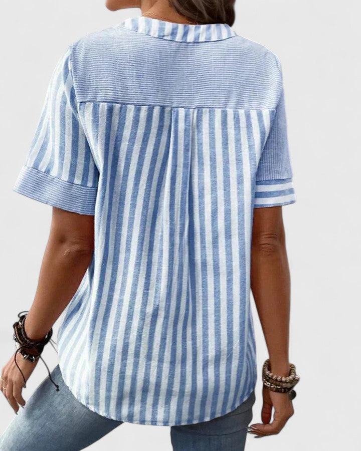 Stylish women's striped blouse, perfect blend of casual comfort and sophisticated workwear elegance.