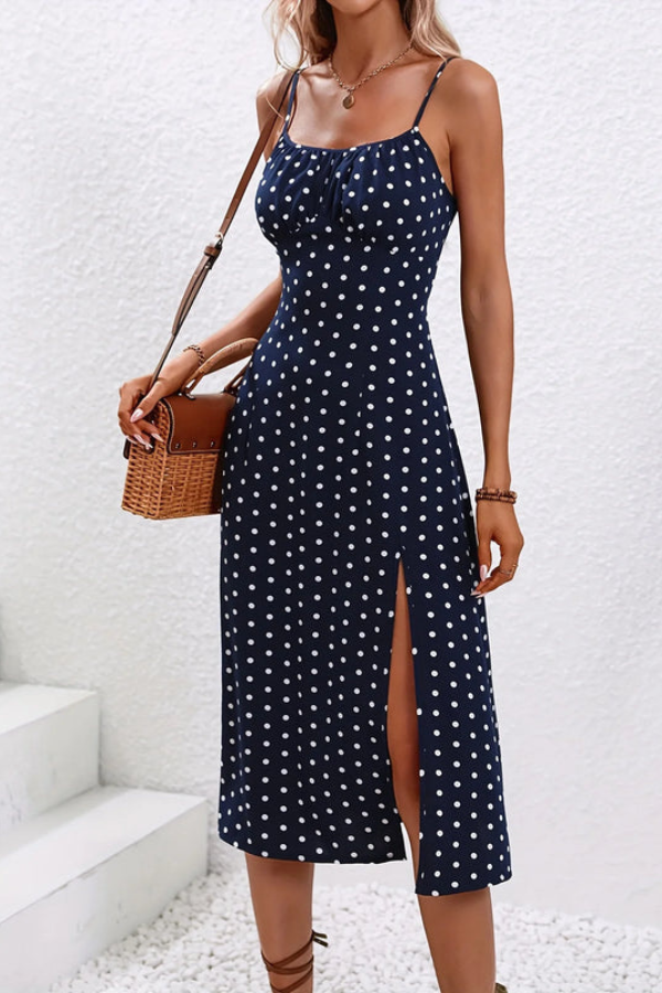 Sleeveless pleated midi dress with a flattering halter neck design, suitable for elegant women's wear.