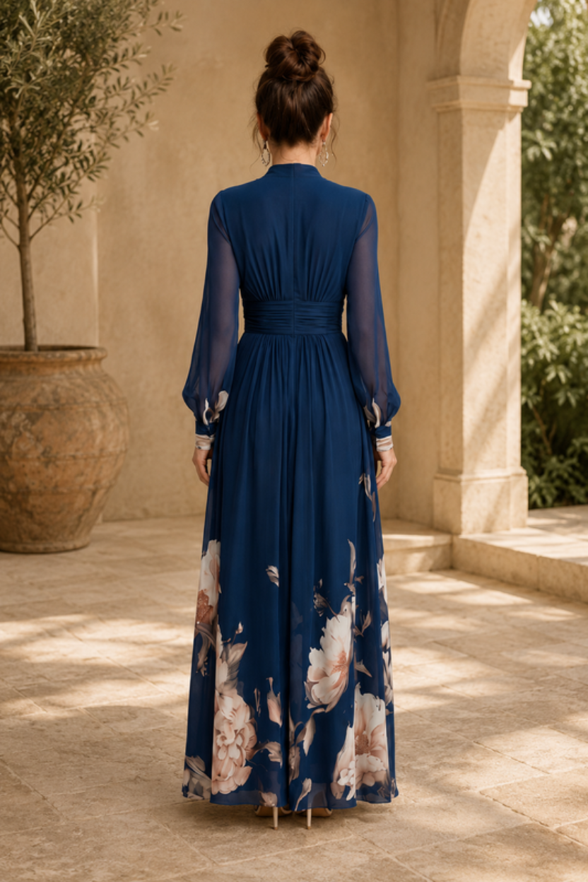 Sophisticated women's pleated maxi dress featuring elegant sheer sleeves, suited for special occasions & formal wear.