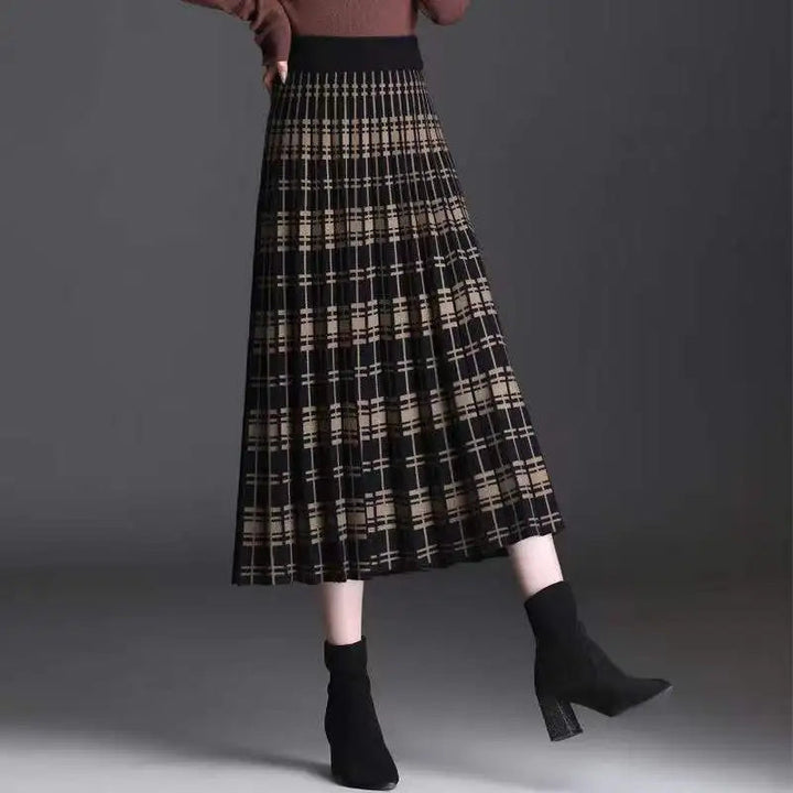 Chic women's pleated midi skirt with high waist, elegant A-line silhouette for versatile fashion.