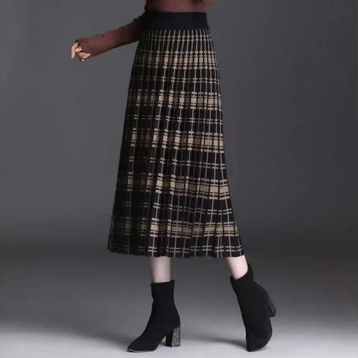 Stylish women's high waist A-line pleated midi skirt, elegant design for a fashionable look.