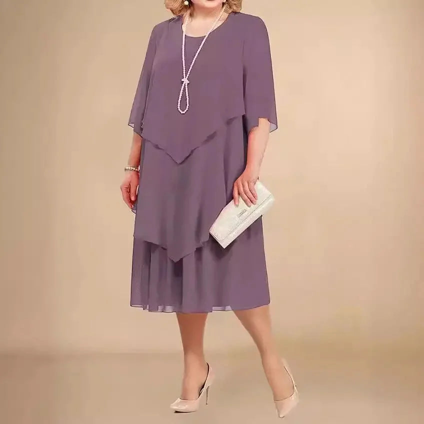 Stylish plus size midi dress with a unique asymmetrical hemline, perfect for parties and special occasions.