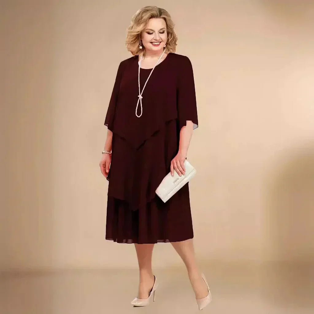 Chic plus size party dress in an asymmetrical midi length, great for elegant special occasions.