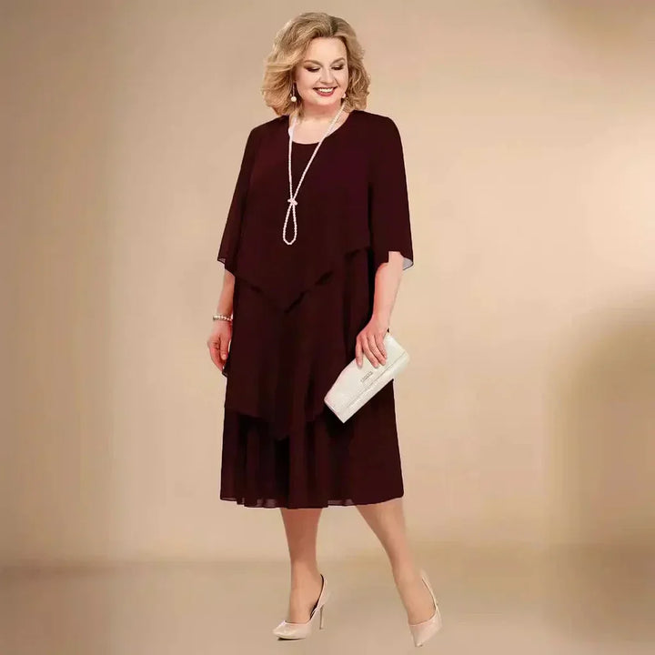 Chic plus size party dress in an asymmetrical midi length, great for elegant special occasions.