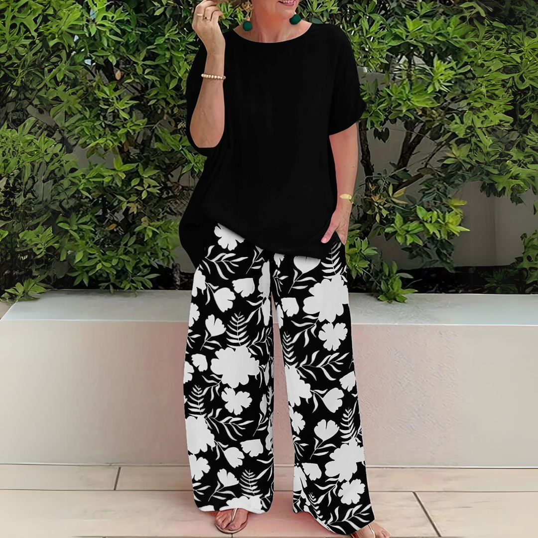 Comfortable plus size women's floral print two-piece outfit featuring stylish wide leg pants.