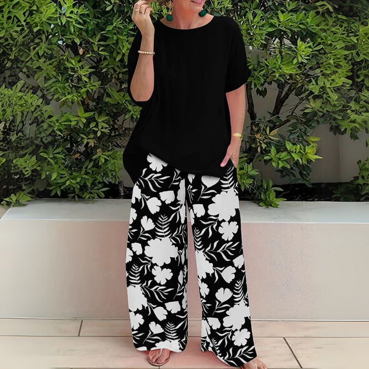 Comfortable plus size women's floral print two-piece outfit featuring stylish wide leg pants.