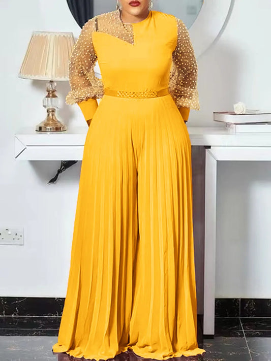 Elegant women's plus size pleated jumpsuit with long sleeves, perfect for all-season stylish wear.
