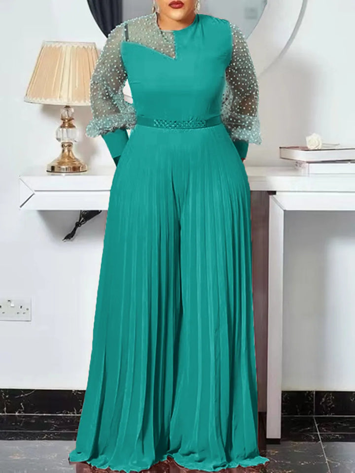 Comfortable plus size women's jumpsuit featuring elegant pleats & long sleeves, ideal versatile outfit.