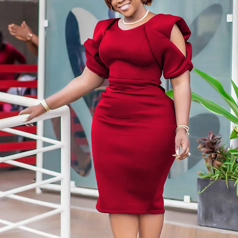 Sophisticated plus size women's elegant knee-length dress with puff sleeves. Great for fall style and occasions.