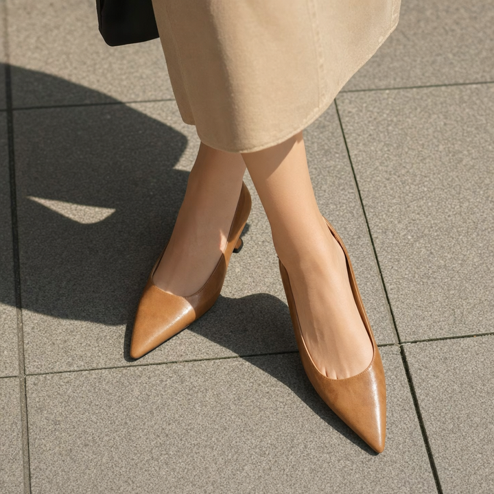 Stylish women's slip-on pumps with a sleek pointed toe and thin heel for fashionable office or party wear.