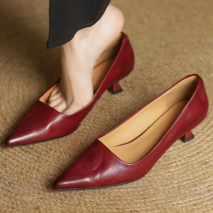Women's slip-on pointed-toe pumps with a slender thin heel, offering an elegant look for any sophisticated outfit.