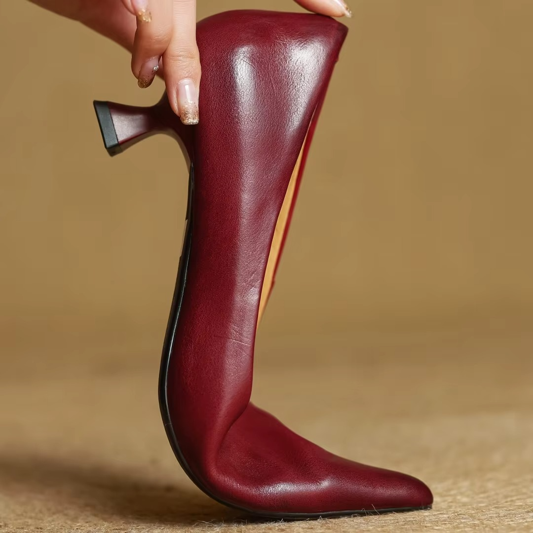 Versatile women's pointed-toe pumps with a chic thin heel, providing elegant comfort for work or special occasions.