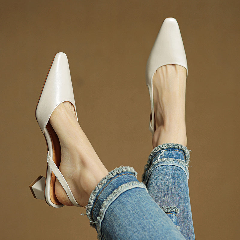 Detail of the comfortable low heel on women's elegant pointed toe dress shoes. Cushioned for all-day wear.