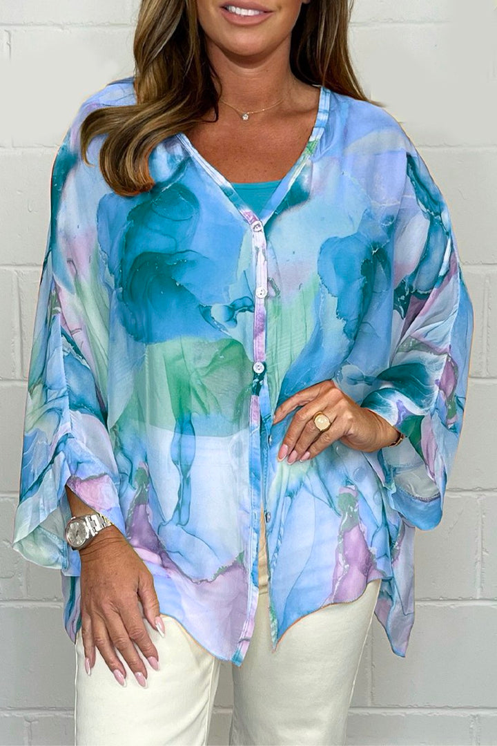 Flowy long sleeve women's printed blouse, lightweight & elegant, ideal for spring/summer fashion and office wear.