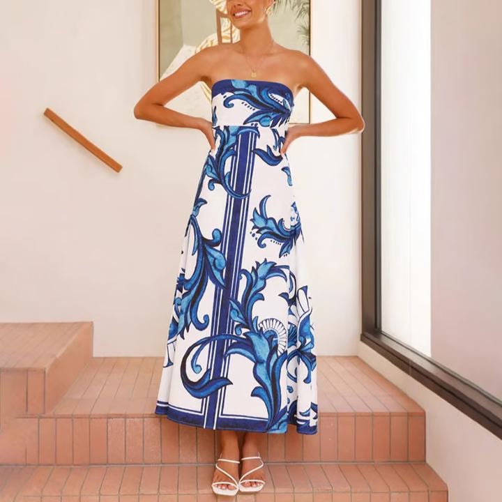 Lightweight summer flowy dress for women, featuring a beautiful print and elegant short sleeves.