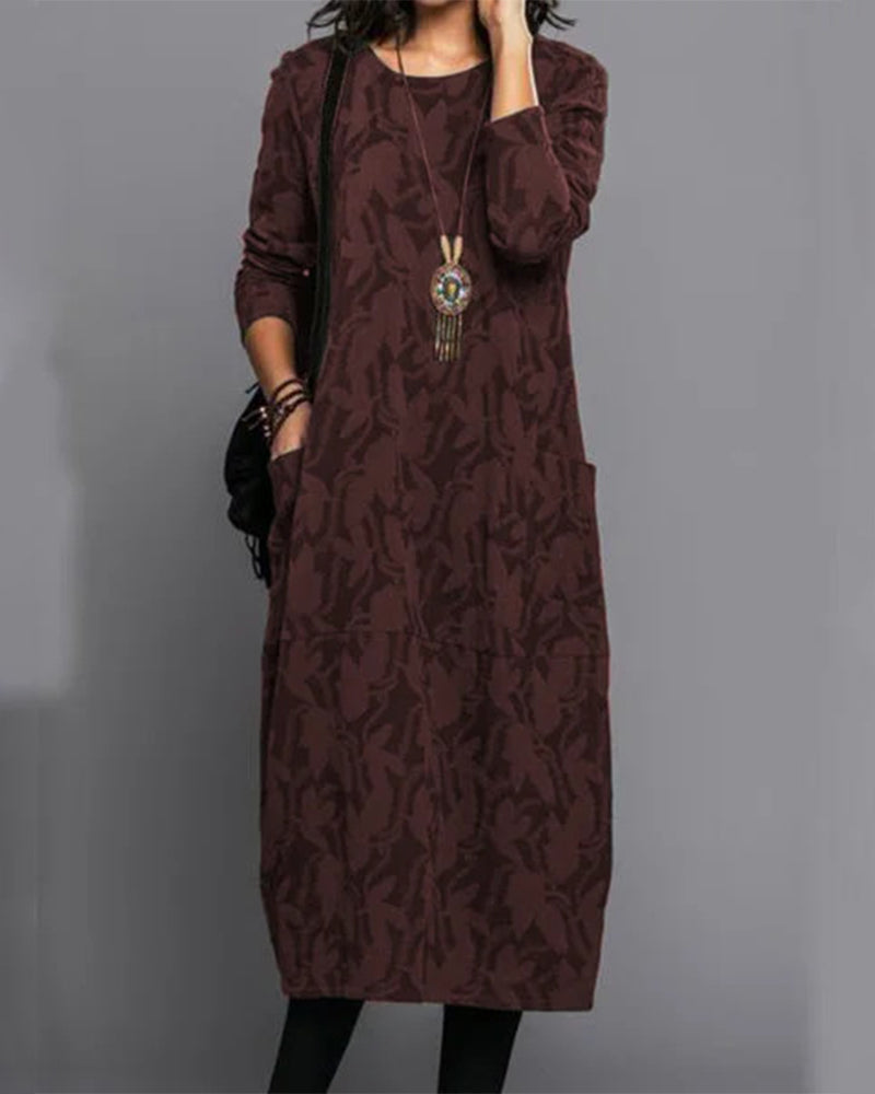 Stylish ladies' printed long-sleeve midi dress with pockets. A versatile and elegant option for fall and winter occasions.