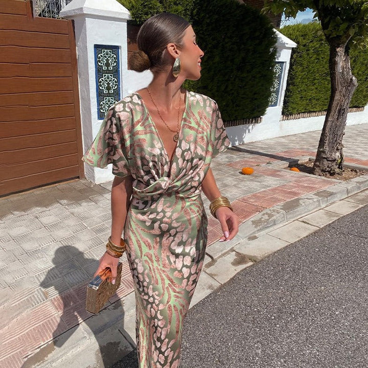 Chic printed maxi wedding guest dress for women, featuring a flattering V-neck and draped sleeves.