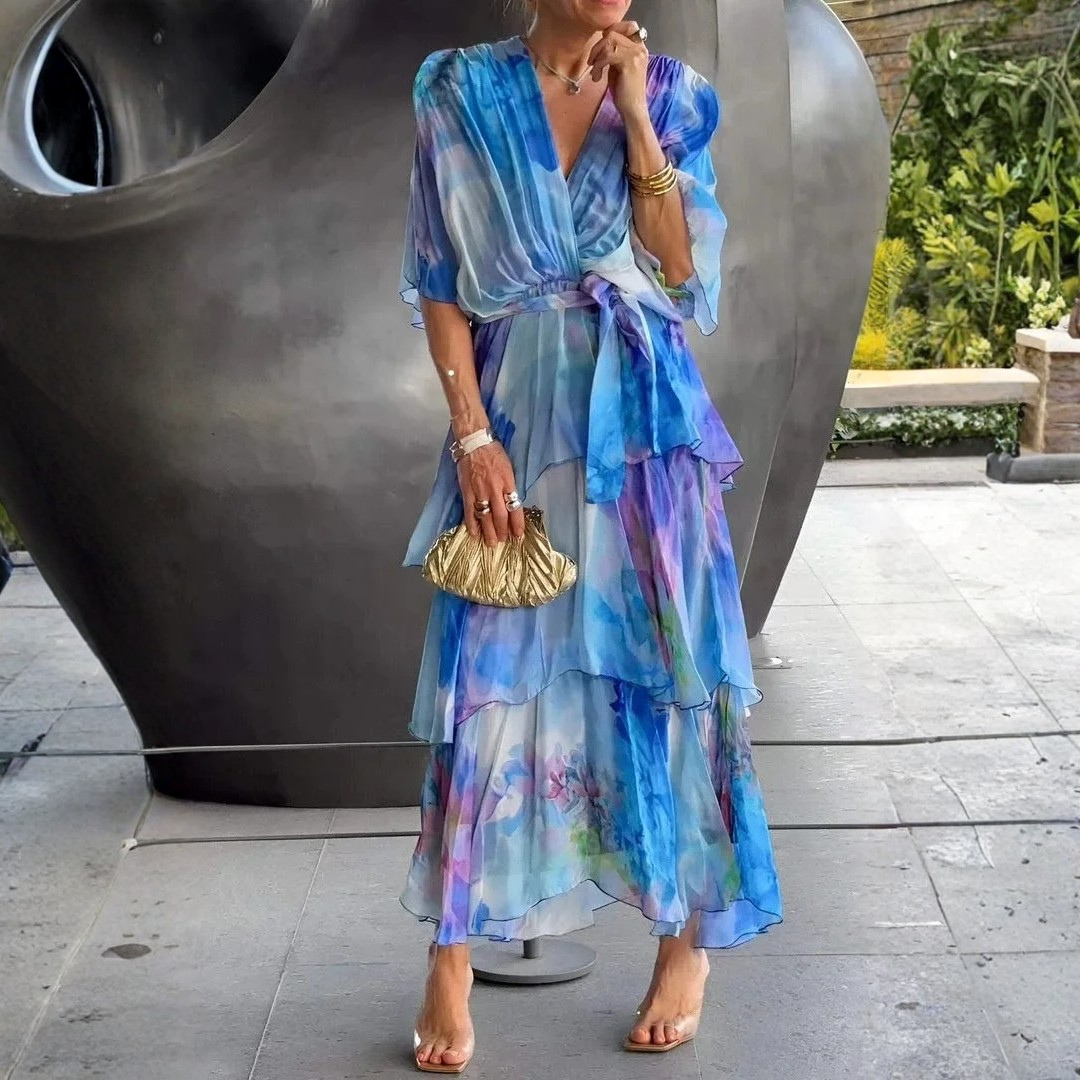 Flowy women's printed wrap dress with tiered skirt, ideal for summer parties and wedding guests.