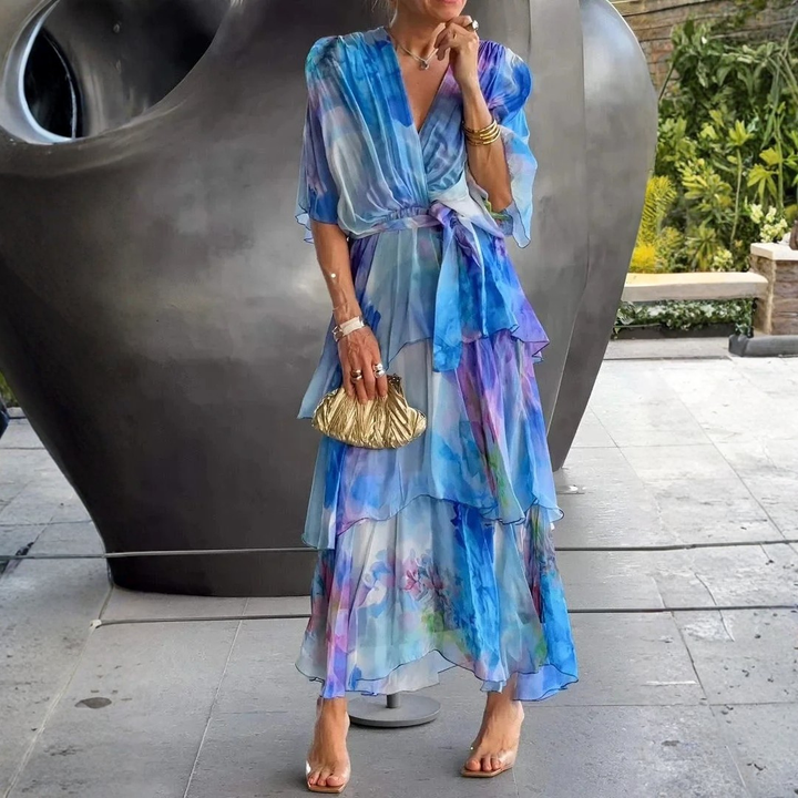 Flowy women's printed wrap dress with tiered skirt, ideal for summer parties and wedding guests.