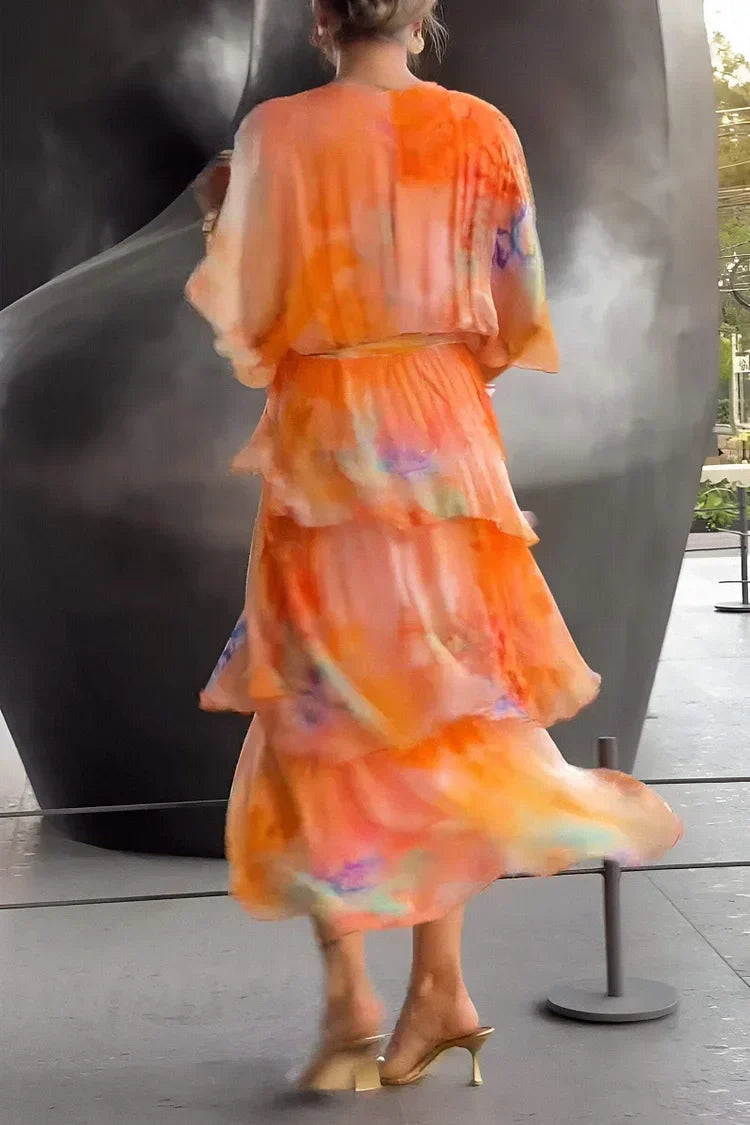 Sophisticated women's printed tiered wrap dress, an elegant choice for evening wear & celebrations.