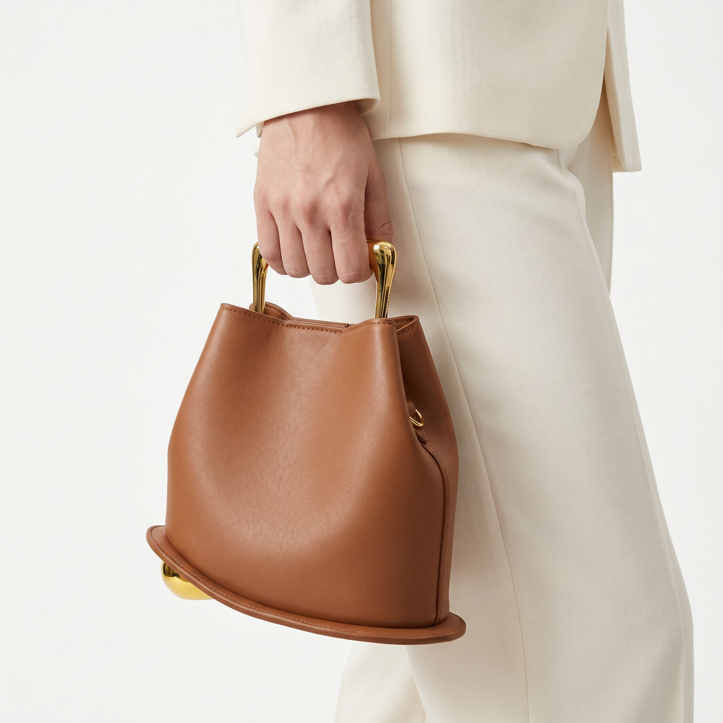 Vibrant orange elegant PU leather bucket bag, a versatile women's fashion handbag.