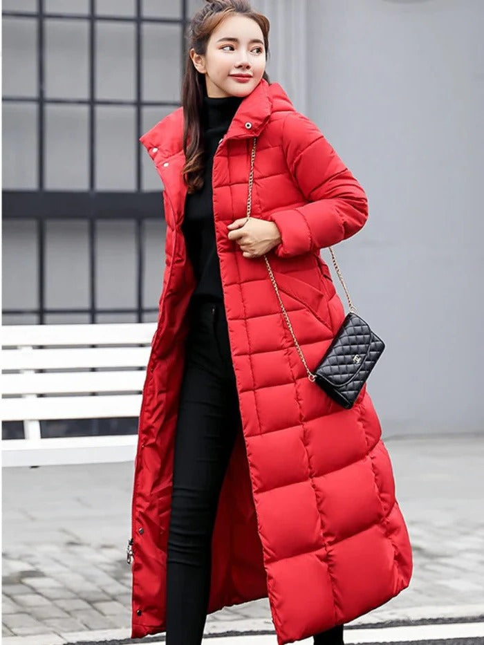 Women's elegant long-sleeve puffer jacket, showcasing a flattering silhouette and warm design for winter style.