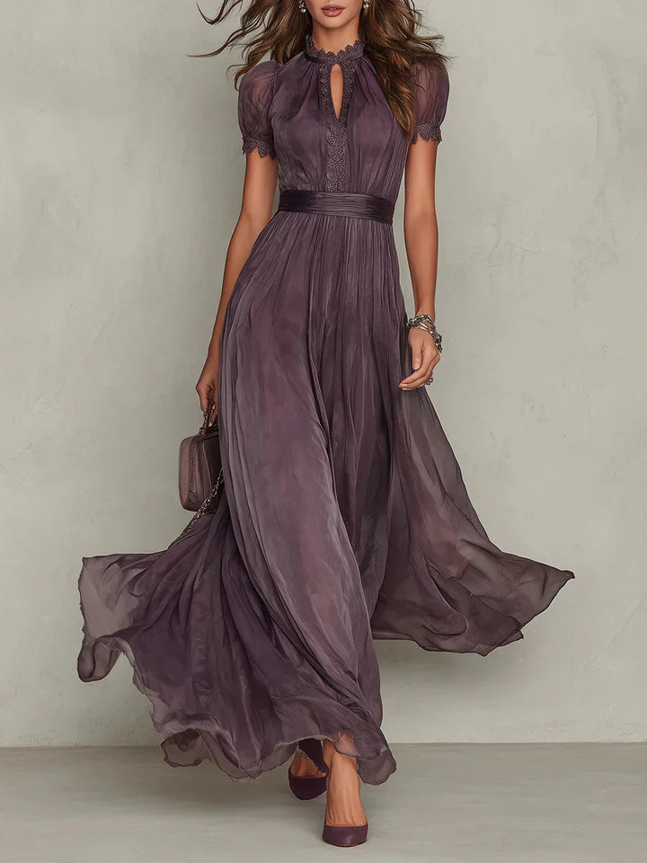 Stylish women's long sleeve maxi dress with delicate floral pattern & pleated skirt in a beautiful purple hue.