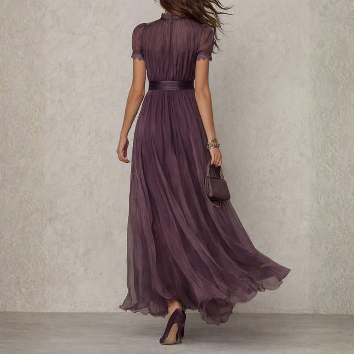 Women's formal purple maxi dress featuring a high neck and delicate lace trim, ideal for special occasions.