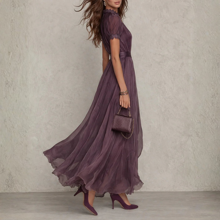 Sophisticated women's long purple dress, an elegant maxi gown with delicate lace trim and high neckline.