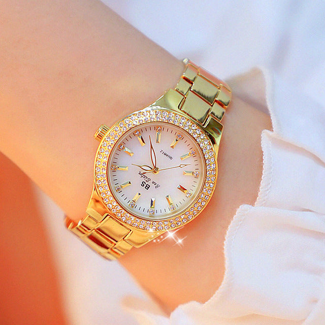 Classic women's quartz watch, available in silver, gold, or two-tone stainless steel. A timeless fashion accessory.