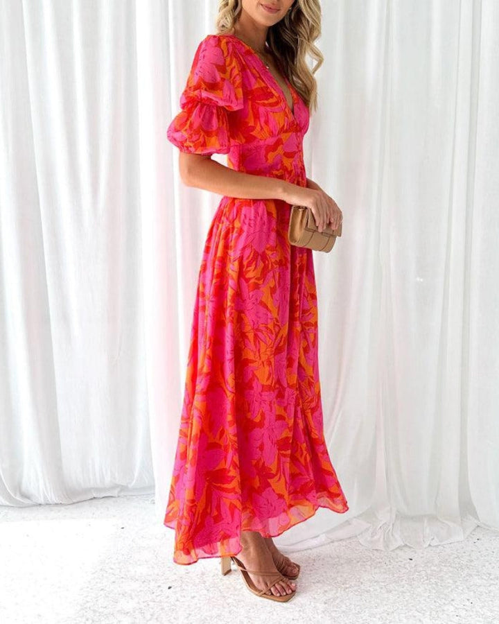 Versatile women's flowy maxi dress, elegant and comfortable, featuring a stylish V-neck and puff sleeves for evening wear.