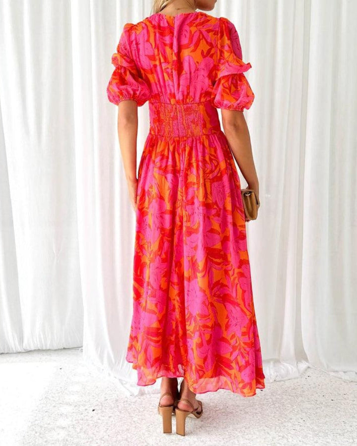 Comfortable women's radiant maxi dress with flowy design, puff sleeves & V-neck, ideal for elegant summer party wear.