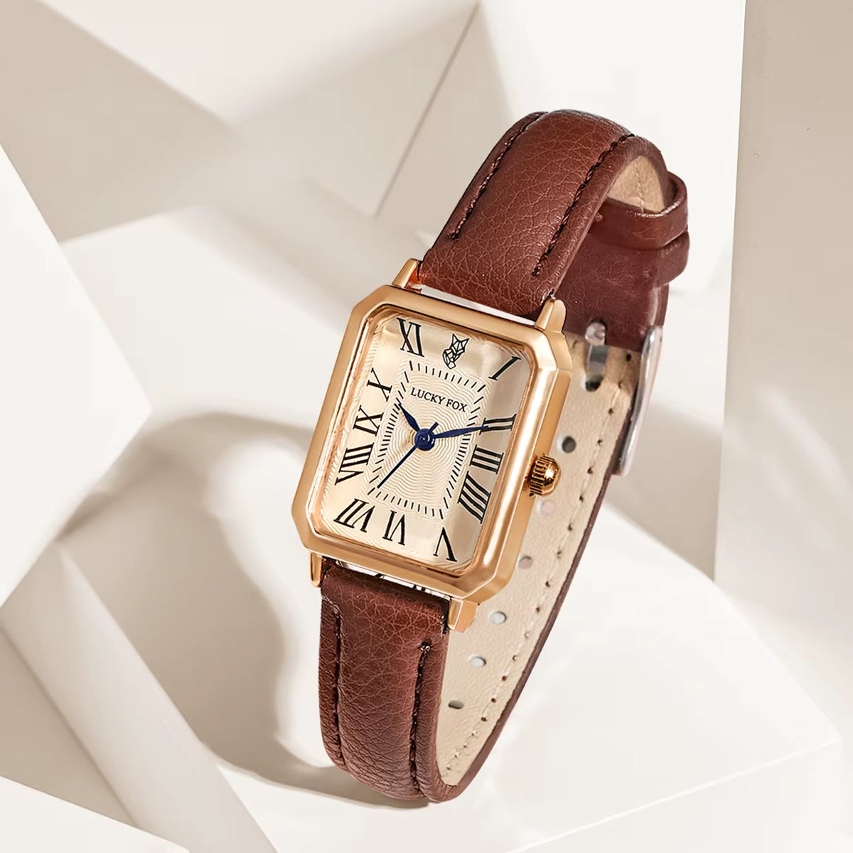 Elegant women's rectangle quartz watch with black leather strap and gold-tone case.